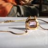 gold plated stainless steel pendant with pink zircon