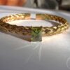 gold plated stainless steel bangle with green zircon