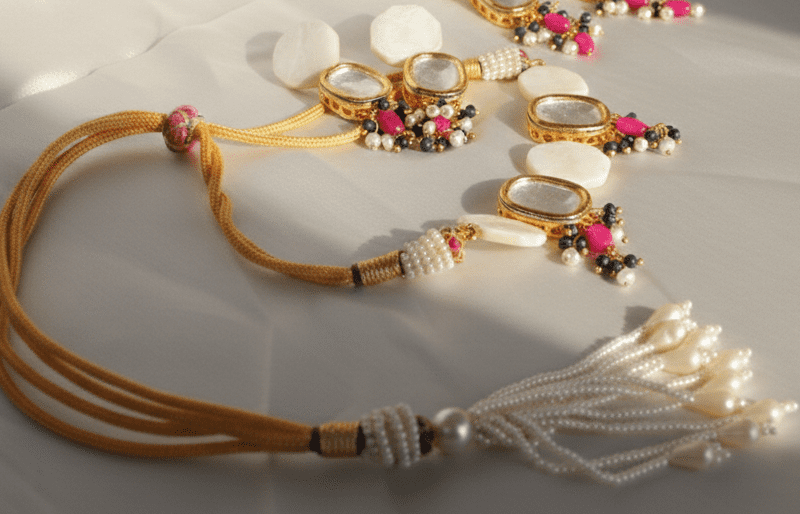 Mother of pearl, sapphire and ruby gemstone kundan wedding jewelry set for women in Pakistan by dango