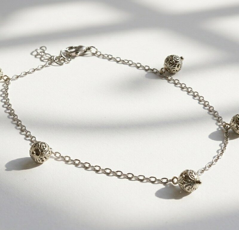 Payal silver filigree ball charm anklet — stainless steel chain with oxidised silver charms, handmade anklet by Dango Pakistan