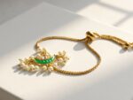 Chand kundan pearl bolo bracelet — gold plated green crescent centrepiece with faux pearl fringe, Meraki collection by Dango Pakistan