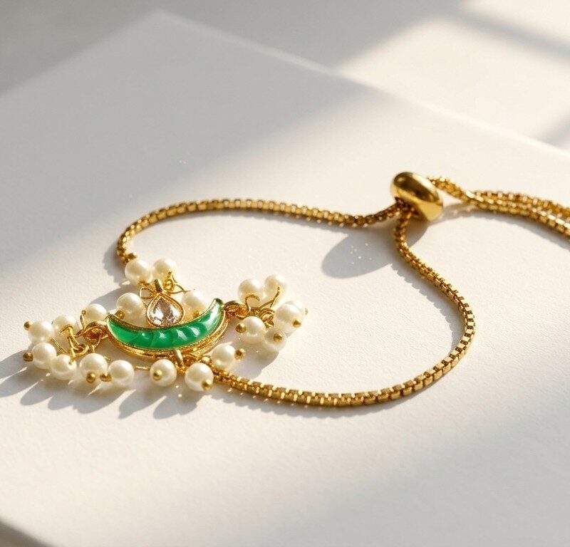 Chand kundan pearl bolo bracelet — gold plated green crescent centrepiece with faux pearl fringe, Meraki collection by Dango Pakistan