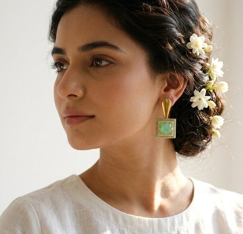 Jahan bold geometric earrings worn — sage green and gold statement earrings, Dango Meraki collection COD Pakistan