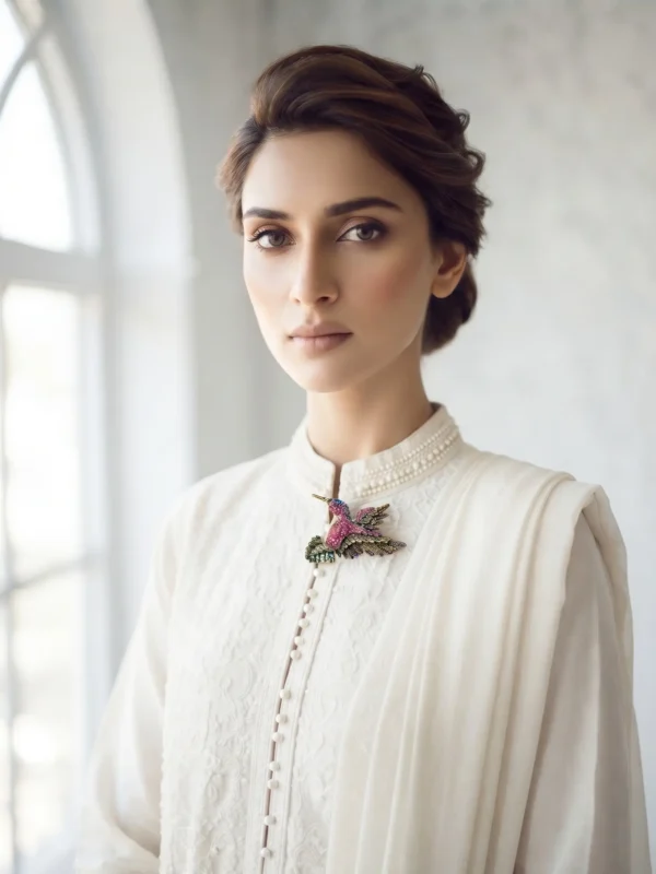 Model in Pakistan wearing the Dango crystal hummingbird brooch pinned securely to a blazer lapel.