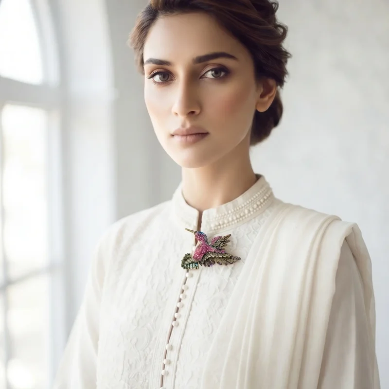 Model in Pakistan wearing the Dango crystal hummingbird brooch pinned securely to a blazer lapel.