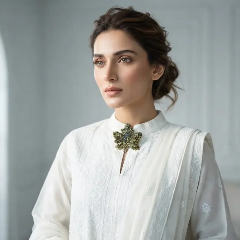 Model in Pakistan wearing the Dango green crystal maple leaf brooch pinned securely to a blazer lapel.