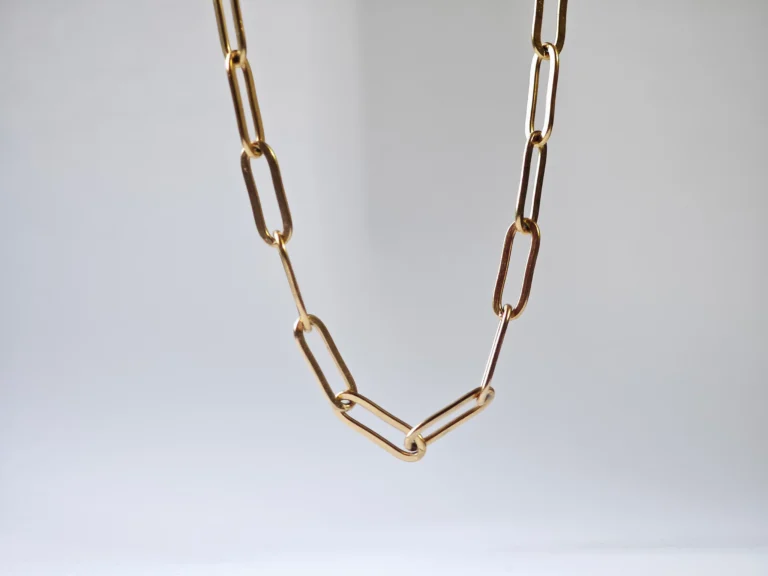 Dango gold plated stainless steel paperclip chain necklace with 45cm length and 0.43cm links, displayed flat on a clean surface in Pakistan.