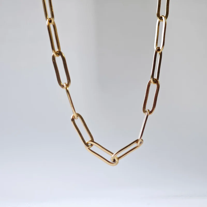 Dango gold plated stainless steel paperclip chain necklace with 45cm length and 0.43cm links, displayed flat on a clean surface in Pakistan.