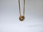 Dango Gold Plated Stainless Steel PVD Zircon Wheel Pendant Necklace, 45+5cm Chain for Women – Delivered Across Pakistan - Image 4